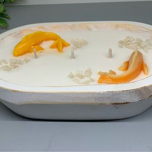 3 wick koi fish in a pond candle.